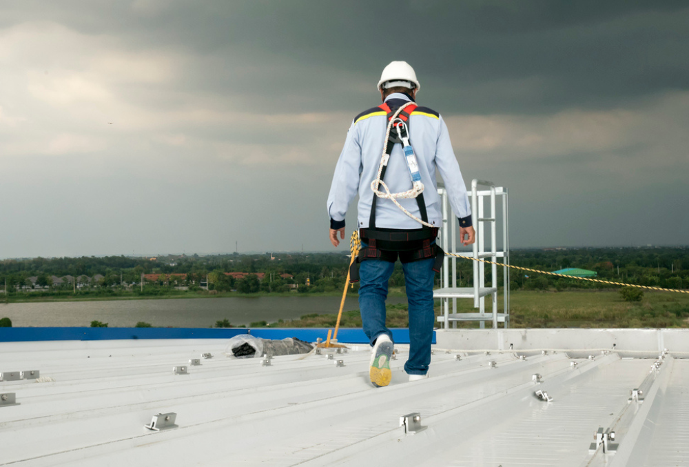 Commercial roofing contractor working on a flat roof in South Jersey