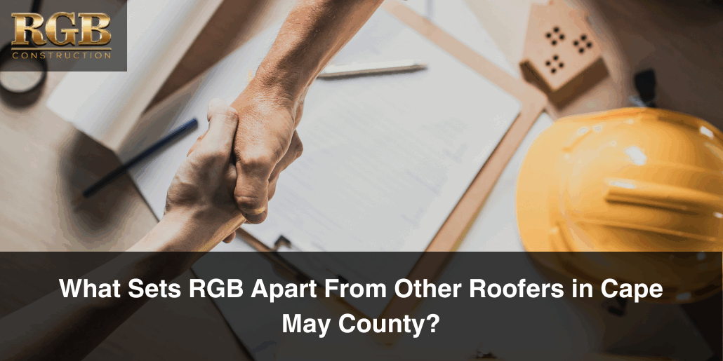 What Sets RGB Apart From Other Roofers in Cape May County Two hand shaking over a roofing contract, portraying that among roofers in Cape May County, RGB seals deals again and again.