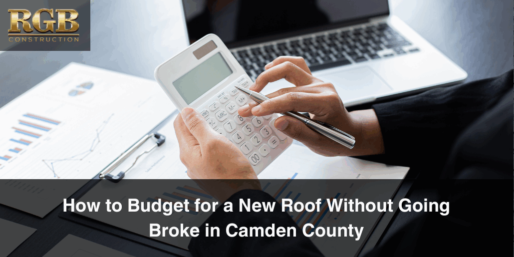 Setting a budget for a new roof with a calculator and paperwork.